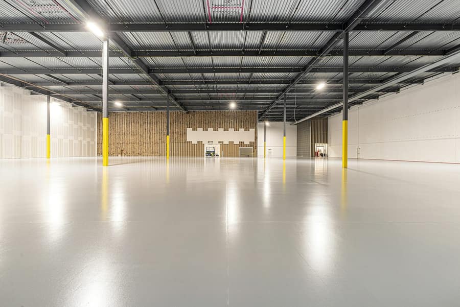 Clean sealed concrete floor surface in a practical workshop interior